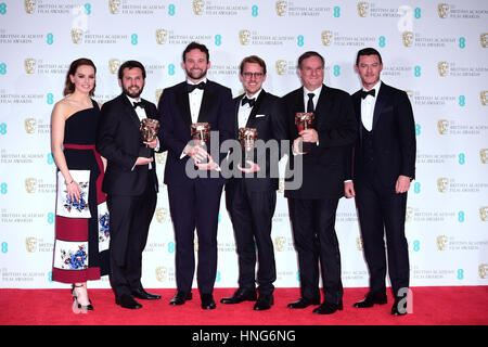 Robert Legato, Dan Lemmon, Andrew R Jones, Adam Valdez with the award for Best Special Visual Effects for the film The Jungle Book alongside Daisy Ridley (left) and Luke Evans (right) in the press room during the EE British Academy Film Awards held at the Royal Albert Hall, Kensington Gore, Kensington, London. Stock Photo