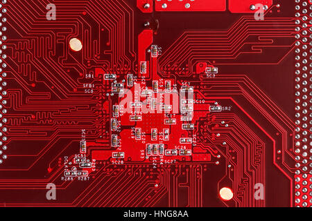 Red electric circuit board background of computer motherboard Stock Photo