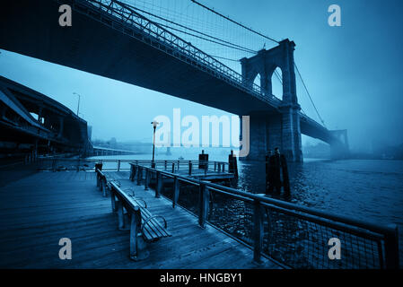 Brooklyn Bridge in a foggy day in downtown Manhattan Stock Photo