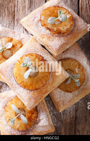 Delicious layer cake with pineapple close-up on the table. vertical view from above Stock Photo