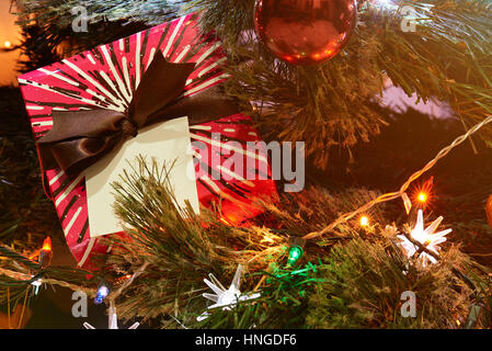 christmas present for kid on christmas  tree with lights and toys Stock Photo