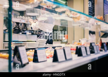 BOLOGNA, ITALY - FEBRUARY 08, 2017. Man making espresso in food court café. Stock Photo