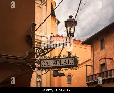 Image of vintage shop sign reading 'cobbler' in Italian. Bologna, italy. Stock Photo