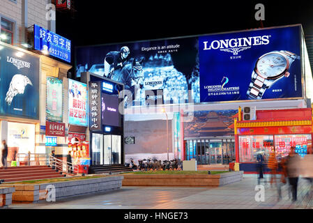 BEIJING, CHINA - APR 1: Wangfujing commercial street at night on April 1, 2013 in Beijing. It is one of the most famous shopping streets in the capita Stock Photo