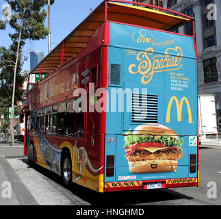 Australian McDonald's advertising at the back of Melbourne Sightseeing Bus parked near Federation square Melbourne Australia Stock Photo