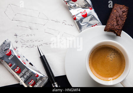 Espresso coffee with a white napkin and healthy snack Stock Photo