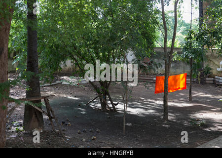 drying buddhism monk robe in the air on clotheshorse Stock Photo