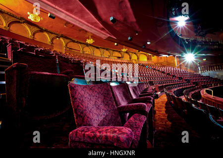 Rows of empty seats in an empty theatre auditorium. Stock Photo