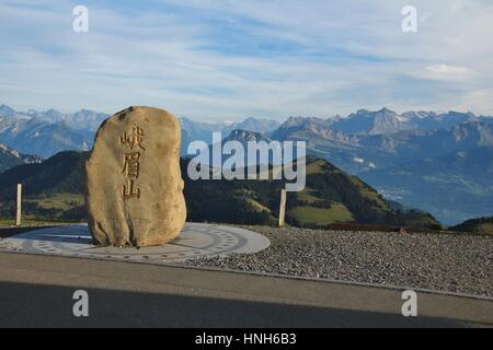 Symbol of partnership between China and Switzerland tourism. Rock of mount Emei on the top of mount Rigi, Switzerland. Stock Photo