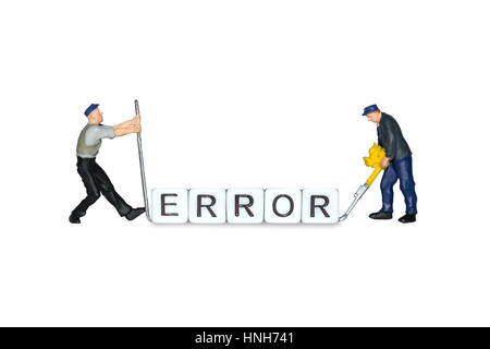 Miniature people. The word error of the cubes. Miniature workers. Human figures, toys. Error page sign. Stock Photo