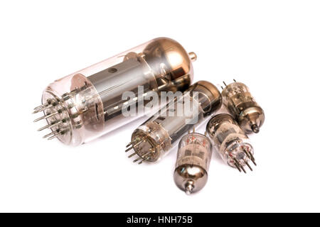 Group of old vacuum tubes isolated on the white background, radio valves. Stock Photo