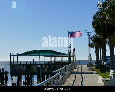 American Flag on the Docks Blowing in a Stiff Breeze, Cedar Key, Florida, USA Stock Photo