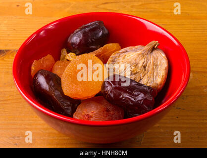 various dried fruits on the wooden background Stock Photo