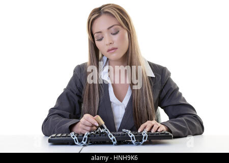 female business woman sitting at her desk locked out of computer Stock Photo