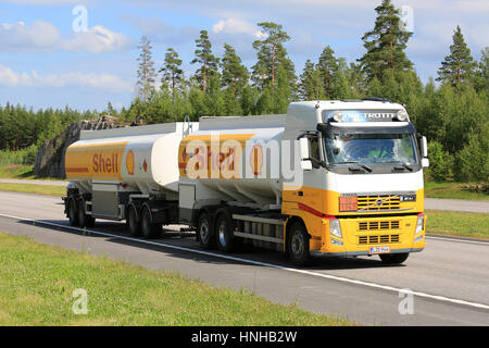 PAIMIO, FINLAND - JULY 1, 2016: Royal Dutch Shell plc, commonly known as Shell, fuel truck Volvo FH hauls jet fuel along freeway on a sunny day if sum Stock Photo