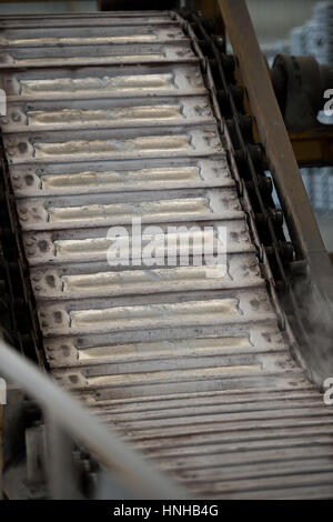 Stack of raw aluminum ingots in aluminum profiles factory, France Stock Photo