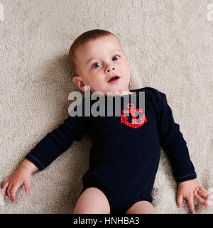 Cute caucasian baby boy wearing a navy sailor outfit Stock Photo