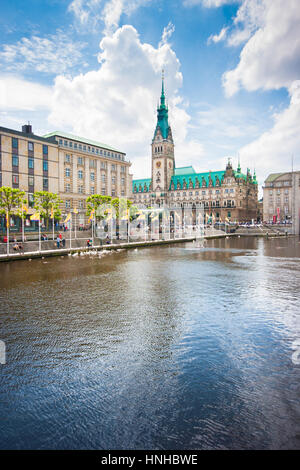 Beautiful view of historic Hamburg city center with famous town hall and scenic Kleine Alster river on a sunny day with blue sky and clouds in summer Stock Photo