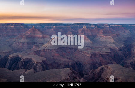 Scenic aerial view of famous Grand Canyon, often considered one of the Seven Natural Wonders of the World, in beautiful post sunset twilight at dusk Stock Photo