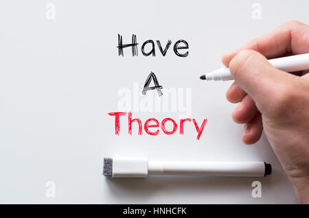 Human hand writing have a theory on whiteboard Stock Photo