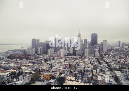 Classic panoramic view of San Francisco skyline in summer with famous San Francisco fog rolling in seen from historic Coit Tower, San Francisco, USA Stock Photo