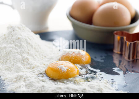 food background of eggs flour and milk, focus on the foreground , ideal for recipe which contains batter, Stock Photo