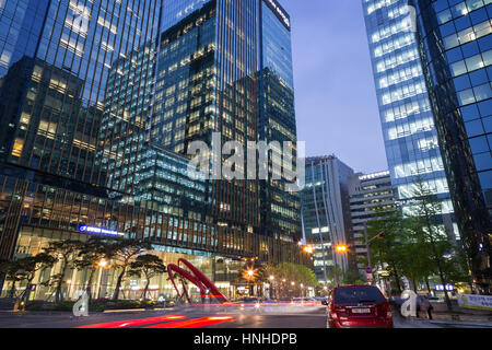 Gran Seoul Building and reflections of another buildings on them and other buildings and street in downtown Seoul, Korea, in the evening. Stock Photo