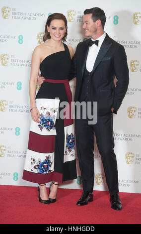 London, UK. 12th Feb, 2017. Actors Daisy Ridley and Luke Evans pose in the winner's room of the EE British Academy Film Awards, Bafta Awards, at the Royal Albert Hall in London, England, Great Britain, on 12 February 2017. Photo: Hubert Boesl - NO WIRE SERVICE - Photo: Hubert Boesl/dpa/Alamy Live News Stock Photo