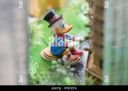 Frankfurt, Germany. 13th Feb, 2017. Dagobert Duck sits among the bank towers in the new model of the city of Frankfurt, Germany, 13 February 2017. The 70 squaremetres large model of the Dutch artist Hermann Helle can be viewed in the Museum of History starting in October in Frankfurt. Photo: Boris Roessler/dpa/Alamy Live News Stock Photo