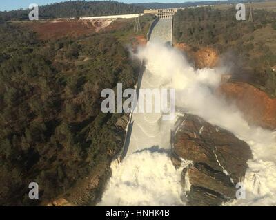 Oroville, USA. 12th Feb, 2017. Aerial photo of the massive amounts of water overwhelming the Oroville Dam spillway eroding the hillside February 12, 2017 in Oroville, California. A mandatory evacuation order was issued for 200,000 residents surrounding the nation's tallest dam. (William Croyle/California DWR via Planetpix) Credit: Planetpix/Alamy Live News Stock Photo
