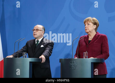 Berlin, Germany. 13th Feb, 2017. German Chancellor Angela Merkel (R) and visiting French Prime Minister Bernard Cazeneuve attend a news conference in Berlin, capital of Germany, on Feb. 13, 2017. Credit: Shan Yuqi/Xinhua/Alamy Live News