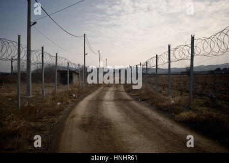 Gevgelija, Macedonia. 13th Feb, 2017. Fence at the Macedonian border with Greece in Gevgelija. As borders remind closed along the refugee route near one hundred migrants of Iraqi, Iranian and Syrian nationalities are staying, most of them since one year ago, at the Temporary Transit Center of Gevgelija. Credit: Jordi Boixareu/Alamy Live News Stock Photo