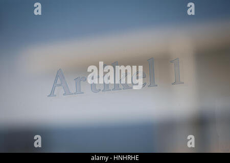 Berlin, Germany. 13th Feb, 2017. A part of an engraved text of the German constitution is seen on a piece of glass outside a government building on 13 February, 2017. Credit: Willem Arriens/Alamy Live News