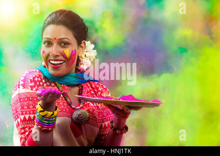 Portrait of a teenage Indian girl celebrating Holi festival with traditional dresses and ornaments Stock Photo