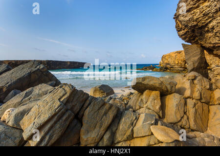 Big  rock on the beach of Aruba Stock Photo