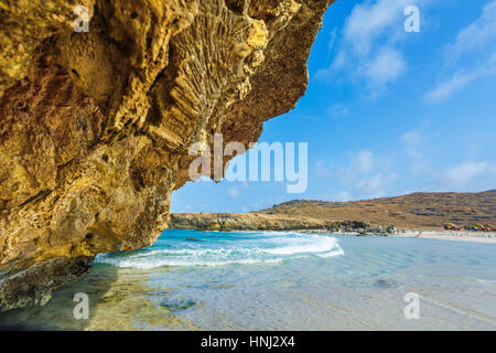 Big  rock on the beach of Aruba Stock Photo