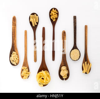 Pasta selection of penne, gnocci, rigatoni, casarecce, fiorelli, pasta Farfalle, pasta A Riso, Orecchiette Pugliesi, Gnocco Sardo and Farfalle in wood Stock Photo
