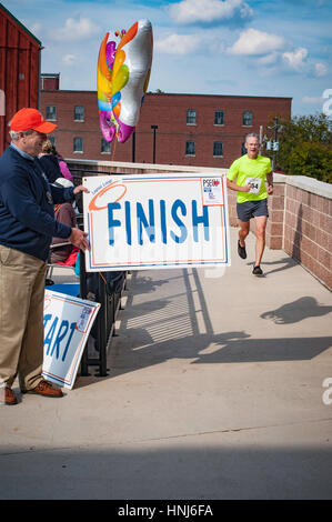 Raising Rase Finish line local Lupus fund raising race Stock Photo - Alamy