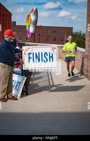 Raising Rase Finish line local Lupus fund raising race Stock Photo - Alamy