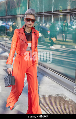 Esther Quek walking before Giorgio Armani fashion show, Milan Fashion Week street style on January 17, 2017 in Milan Stock Photo