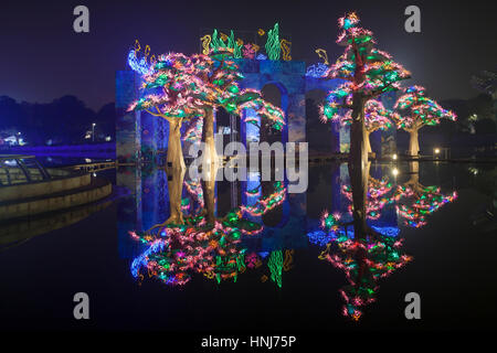 DUBAI, UAE - DEC 6, 2016: Beautiful installations at the Dubai Garden Glow family theme park illuminated at night. United Arab Emirates, Middle East Stock Photo