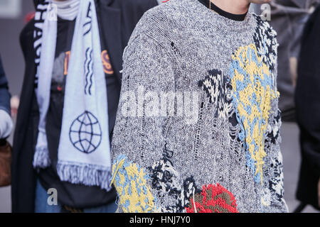 Man with torn gray sweater before MSGM at Armani fashion show, Milan Fashion Week street style on January 16, 2017 in Milan. Stock Photo