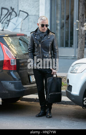 Man with black leather jacket and trousers before MSGM fashion show, Milan Fashion Week street style on January 16, 2017 in Milan. Stock Photo