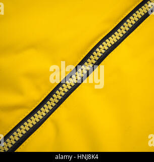 Close up zipper on a yellow background Stock Photo