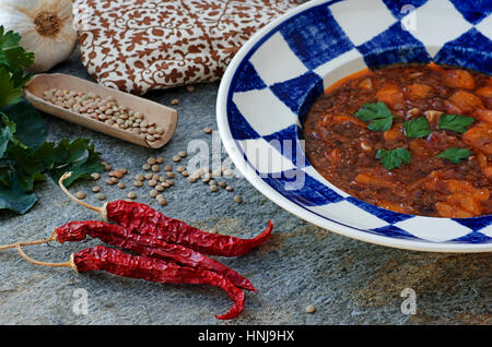 Spicy lentil soup with carrots, garlic and chilli peppers Stock Photo