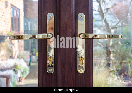 Door handles on a set of french windows Stock Photo