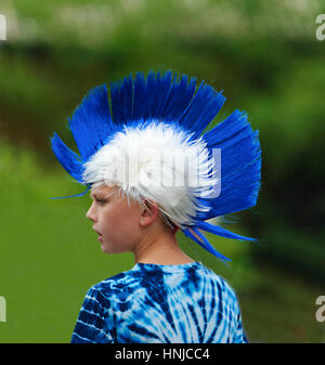 A young boy wears a blue and white iroquois wig on Australia Day 2017, Berrima, New South Wales, Australia Stock Photo