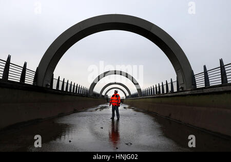 Steven Berry Scottish Canals head of operational delivery views the drained aqueduct at the Falkirk Wheel as the second phase of winter maintenance on the world's only rotating boat lift is currently underway, with Scottish Canals' engineers de-watering the structure in order to replace the gate bearings, with the attraction reopening to boat trips on March 8th. Stock Photo