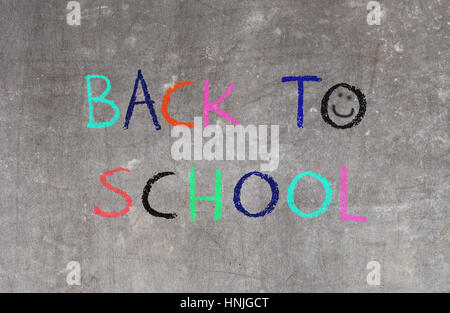 Back to school written on a blackboard Stock Photo