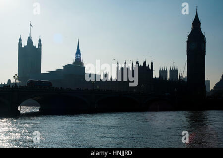 London, UK. 13th Feb, 2017. A shop sells souvenirs of the union flags which fly in a sunny winter afternoon in front of the Elizabeth Tower also known as Big Ben and the Houses of Parliament. Credit: Alberto Pezzali/Pacific Press/Alamy Live News Stock Photo